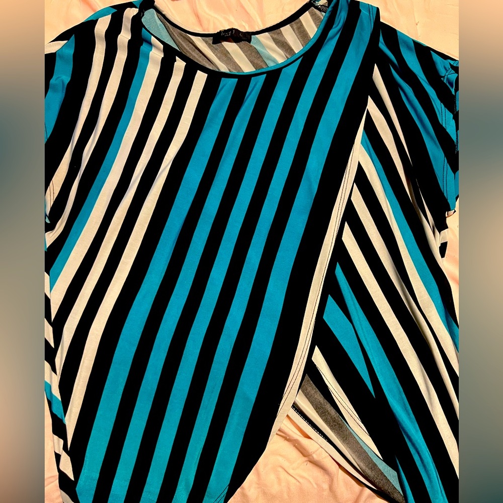 Unique and cool top with a criss cross design, size large